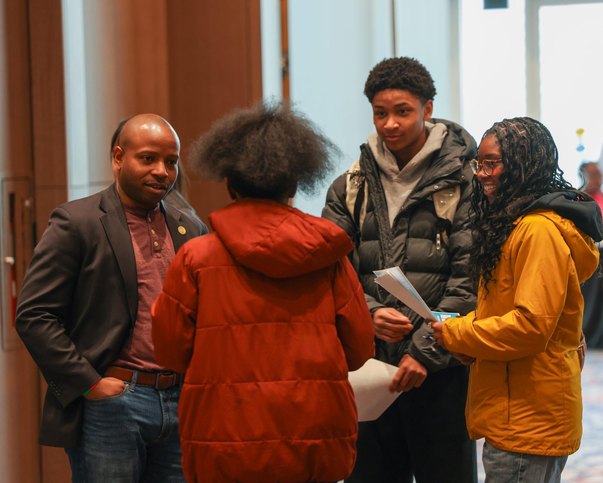 Checking in with teens at the All In, All Youth, All Summer resource and employment fair