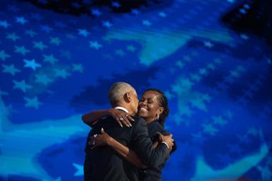 August 20, 2024 – Chicago, Illinois: Former President Barack Obama hugs former First Lady Michelle Obama after her remarks at the Democratic National Convention in Chicago.