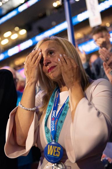 August 21, 2024 – Chicago, Illinois: A woman cries during Oprah Winfrey’s remarks at the Democratic National Convention.