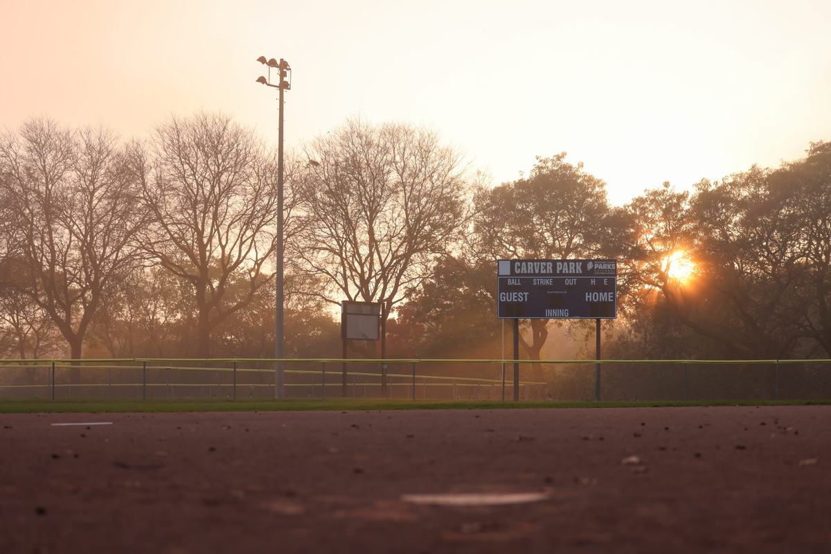 The sun begins to set on the softball field in Carver Park on Oct. 22. (Photo by Jonathan Aguilar / Milwaukee Neighborhood News Service / CatchLight Local)