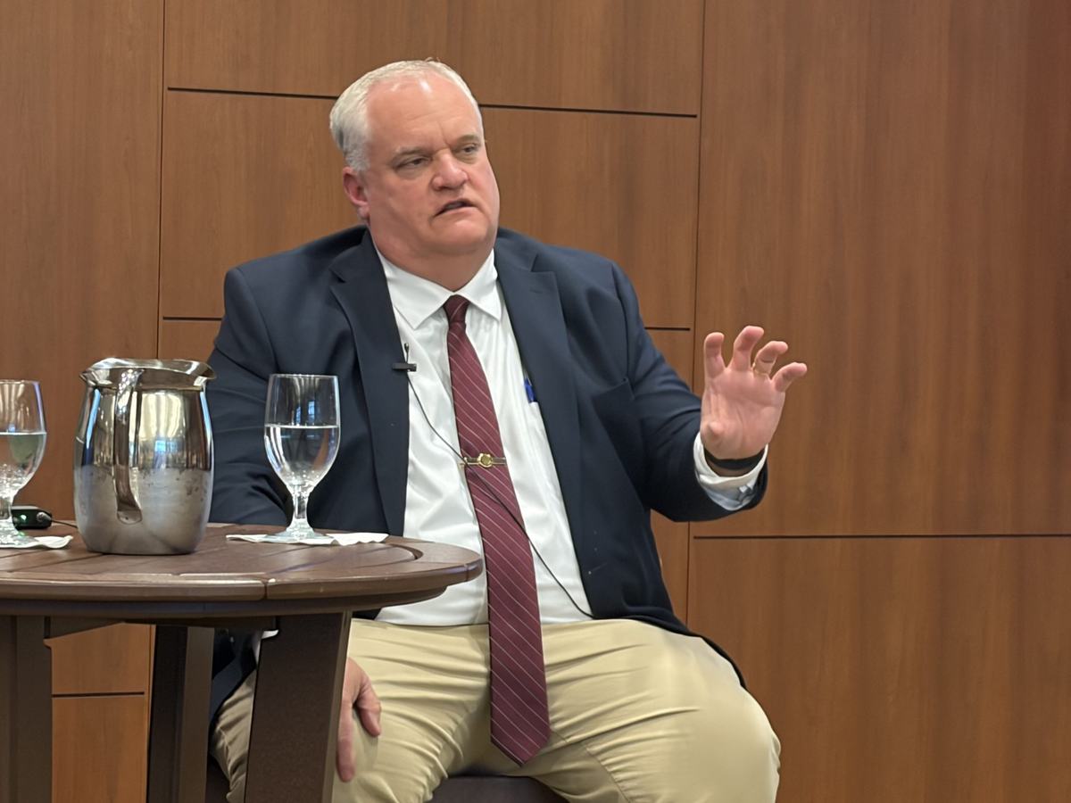DeForest Police Chief James Olson, vice president of the Wisconsin Police Chiefs Association, speaks during a panel discussion on automatic license plate readers at Marquette University Law School. (Photo by Devin Blake)