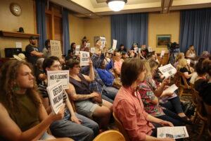 People fill up a Milwaukee Fire and Police Commission meeting to call for an end to Flock in the city. (Photo by Isiah Holmes/Wisconsin Examiner)