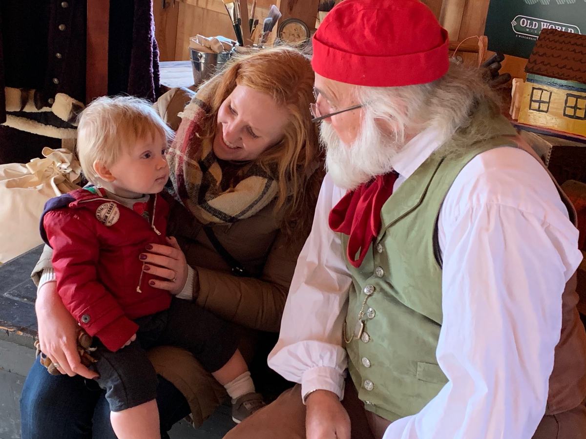 a mother and son with Santa