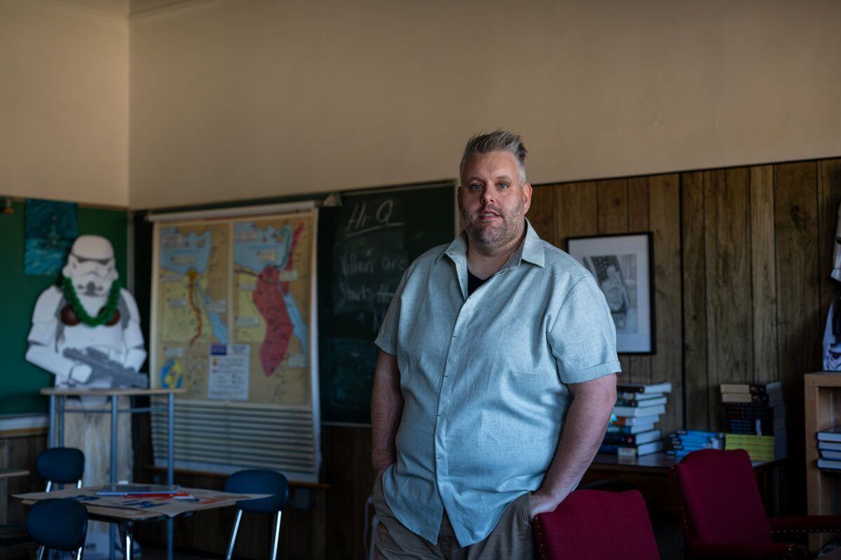 History teacher, Alex Stevens, in his classroom at St. Thomas Aquinas Academy, in Marinette, Wisconsin, reflects on his time as a student at UW-Marinette. (Kara Counard)