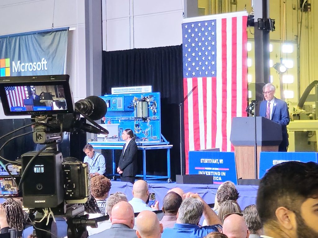 Wisconsin Governor Tony Evers speaks ahead of President Joe Biden in Sturtevant, Wis. on May 8, 2024. Biden announced that Microsoft will invest $3.3 billion into southeastern Wisconsin.