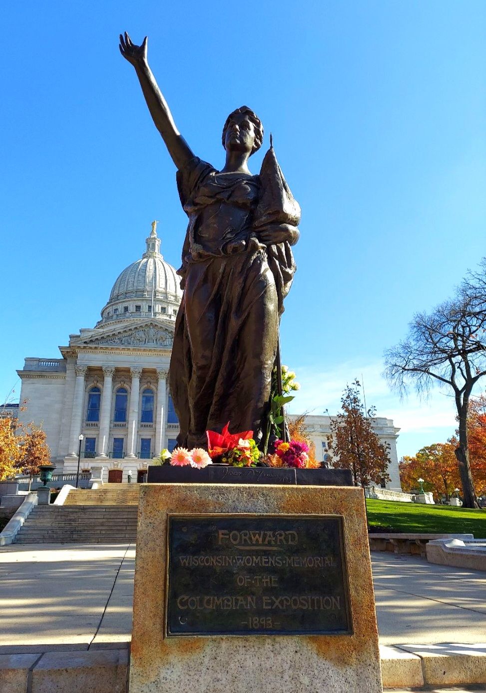 The "Miss" FORWARD statue is turning into a memorial as people are laying cards and flowers at her feet. Several explaining it is in mourning of the inability to elect a woman president. Another person called it a powerful statement, given Wisconsin's progressive nature over the years.