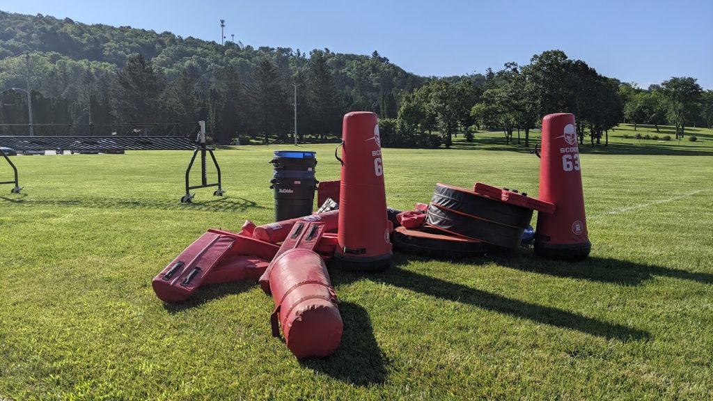 A random assortment of football practice equipment, including pads.