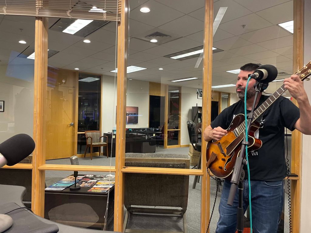 Stefan Hall on guitar at Civic Media's WMDX studio.... The Lair.