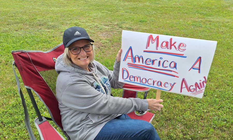 Sign reading make America a democracy again
