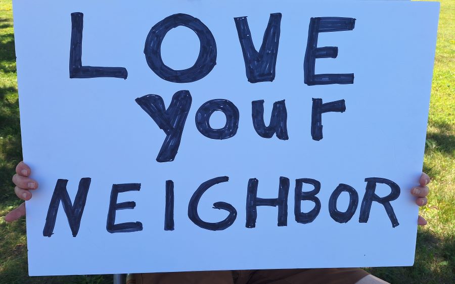 Sign reading Love Your Neighbor