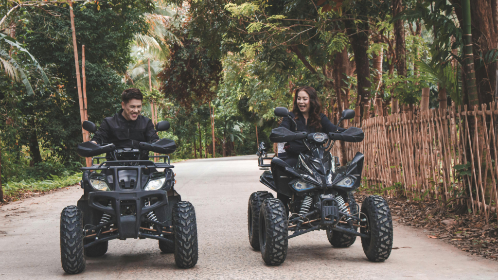 ATV and UTV on paved road.