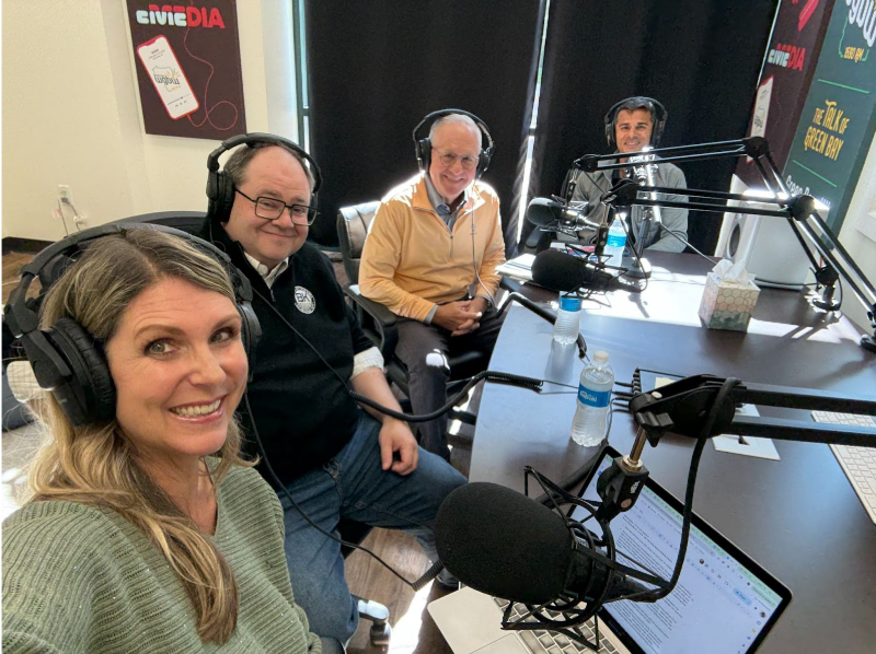 Photo of Dr. Kristin Lyerly, John Brogan, Kurt Voss and Sachin Shivaram in WGBW Studio during the recording of this episode smiling at the camera