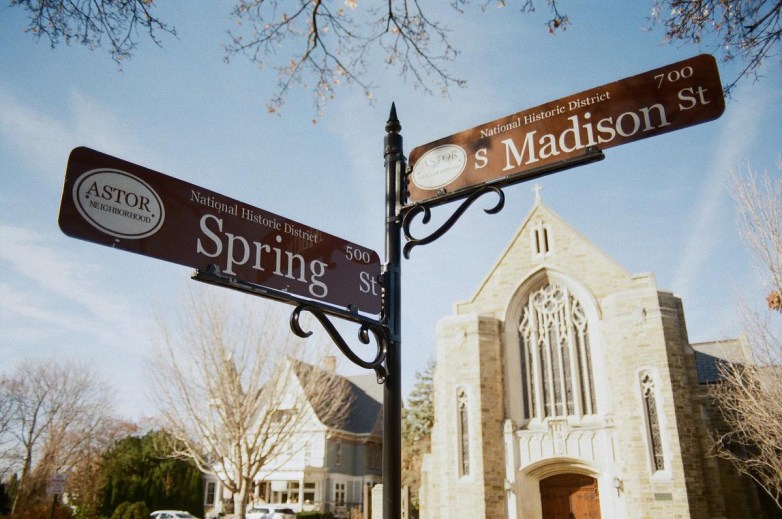 Street signs marked “Spring St” and “S Madison St” and