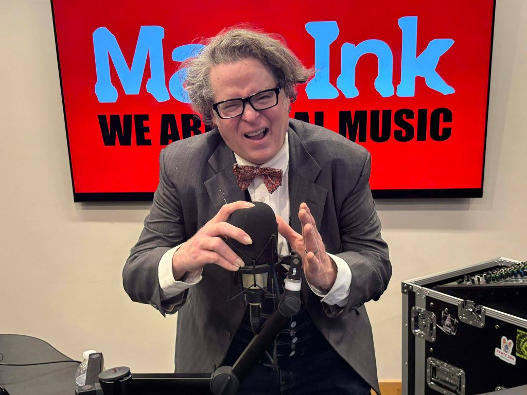 Sean Michael Dargan striking the Elvis Costello pose, photo by Jane Lowy