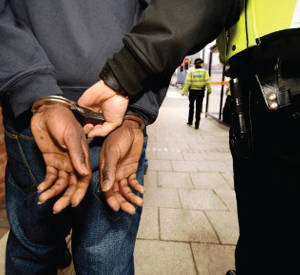 white-police-officer-handcuffing-black-man